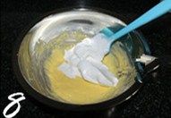 椰香戚风蛋糕,取1/3蛋白加入蛋黄糊中，翻拌均匀；