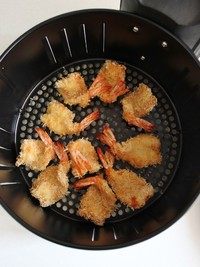 一虾两吃之辣脆虾头&酥香虾尾,选择“炸虾程序”，温度180°时间10分钟，待听到蜂鸣音后就可以打开空气炸锅，将虾取出了。