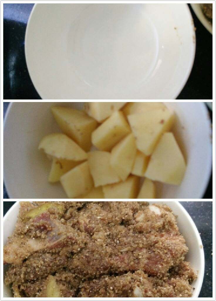 粉蒸排骨,选一个干净的碗（盘子也可以），底下铺土豆，上面铺裹米粉的排骨