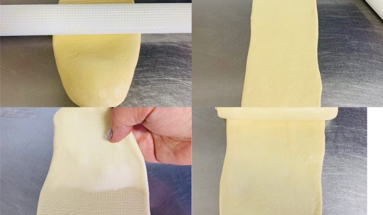 超级松软一次发酵，奶香吐司🍞,取一小面团光面朝上，用擀面棍从中间向上、向下擀成40厘米长，反面，从上轻轻卷起。