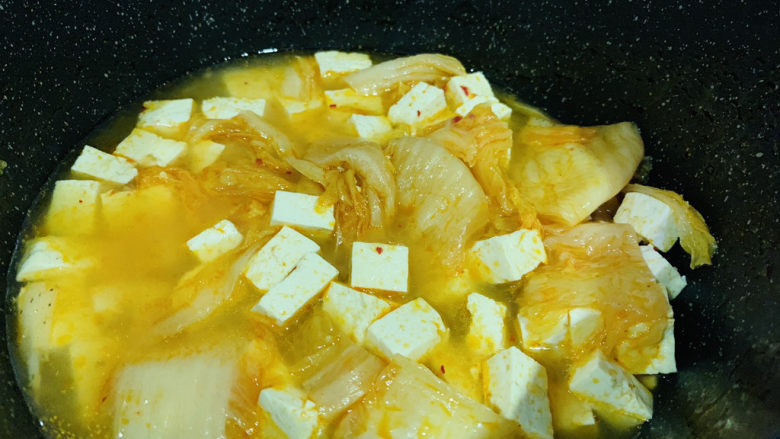 辣白菜豆腐汤,搅拌均匀，起锅